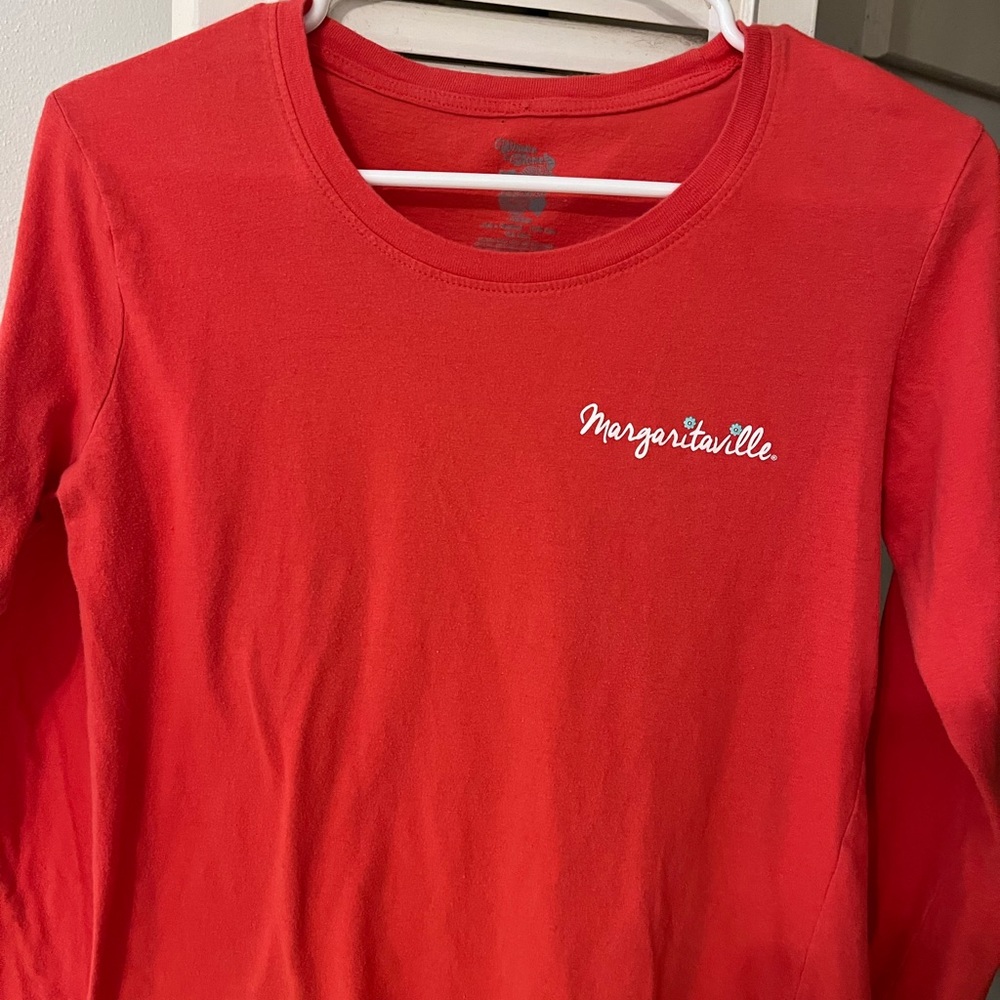 Jimmy Buffett long sleeve women T-shirt size medium. Good condition/coral-orange